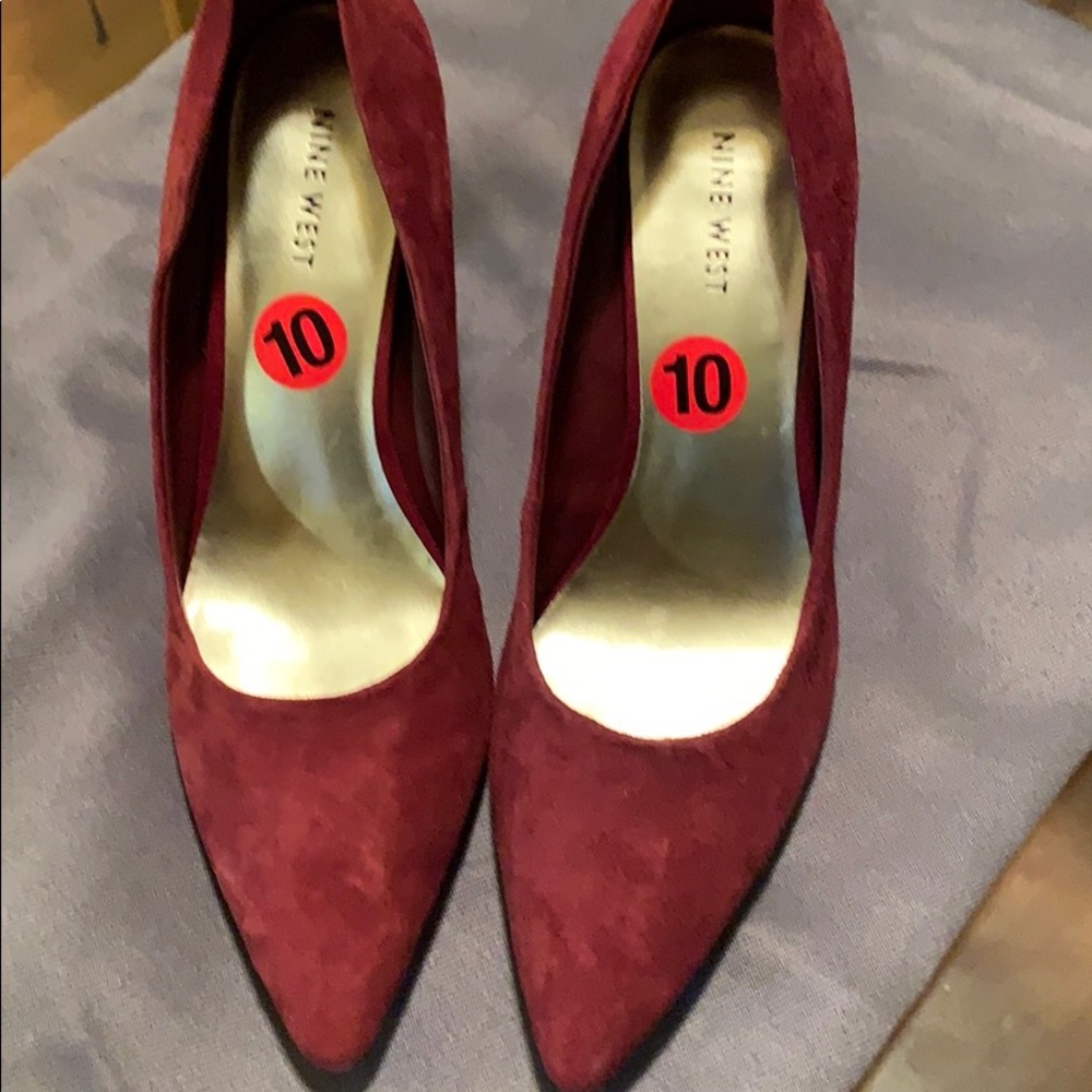 Red suede pumps